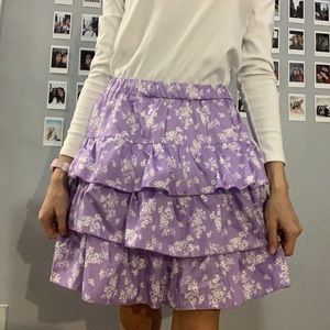 Purple ruffled skirt with white flowers